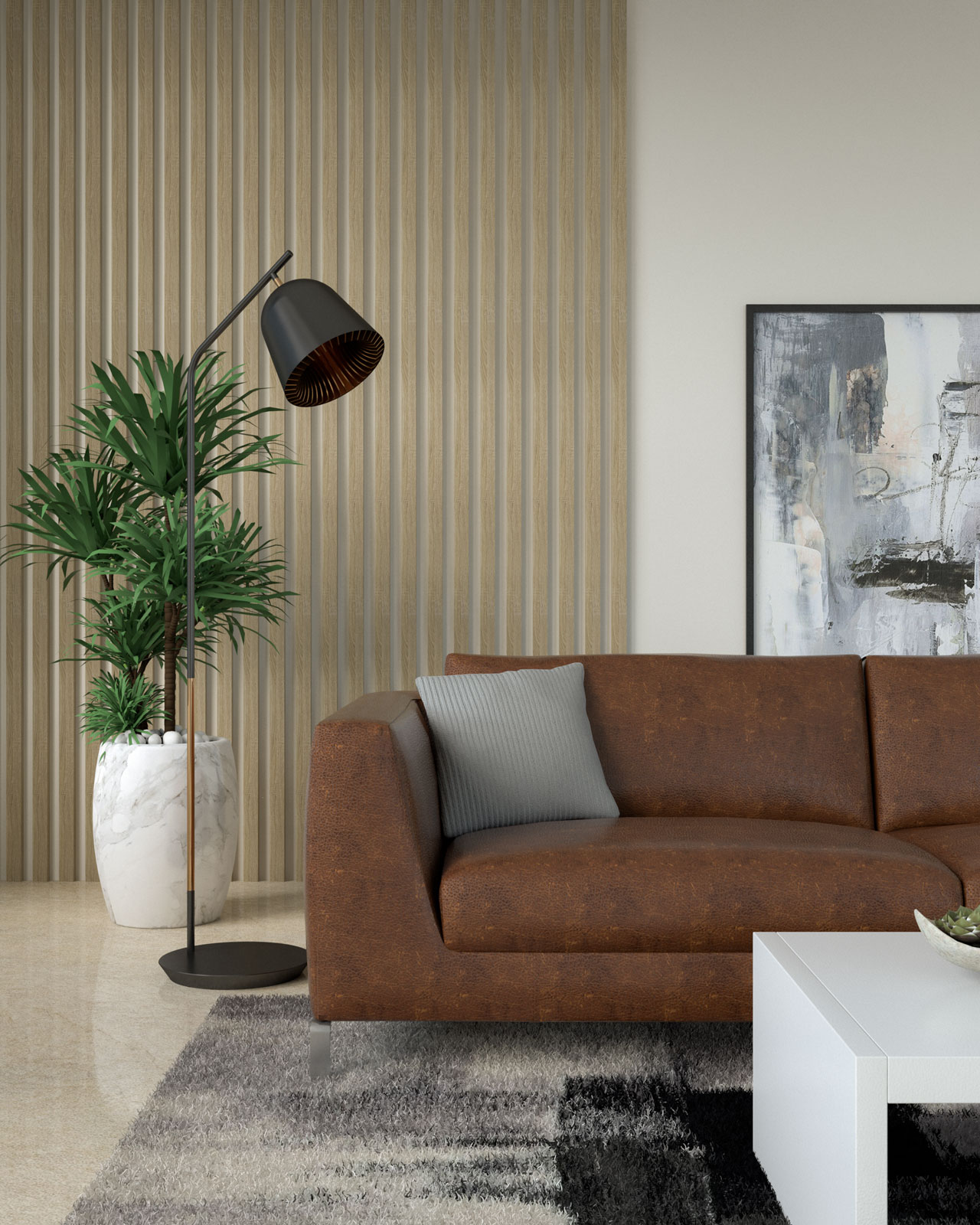 Brown leather couch with gray throw pillow